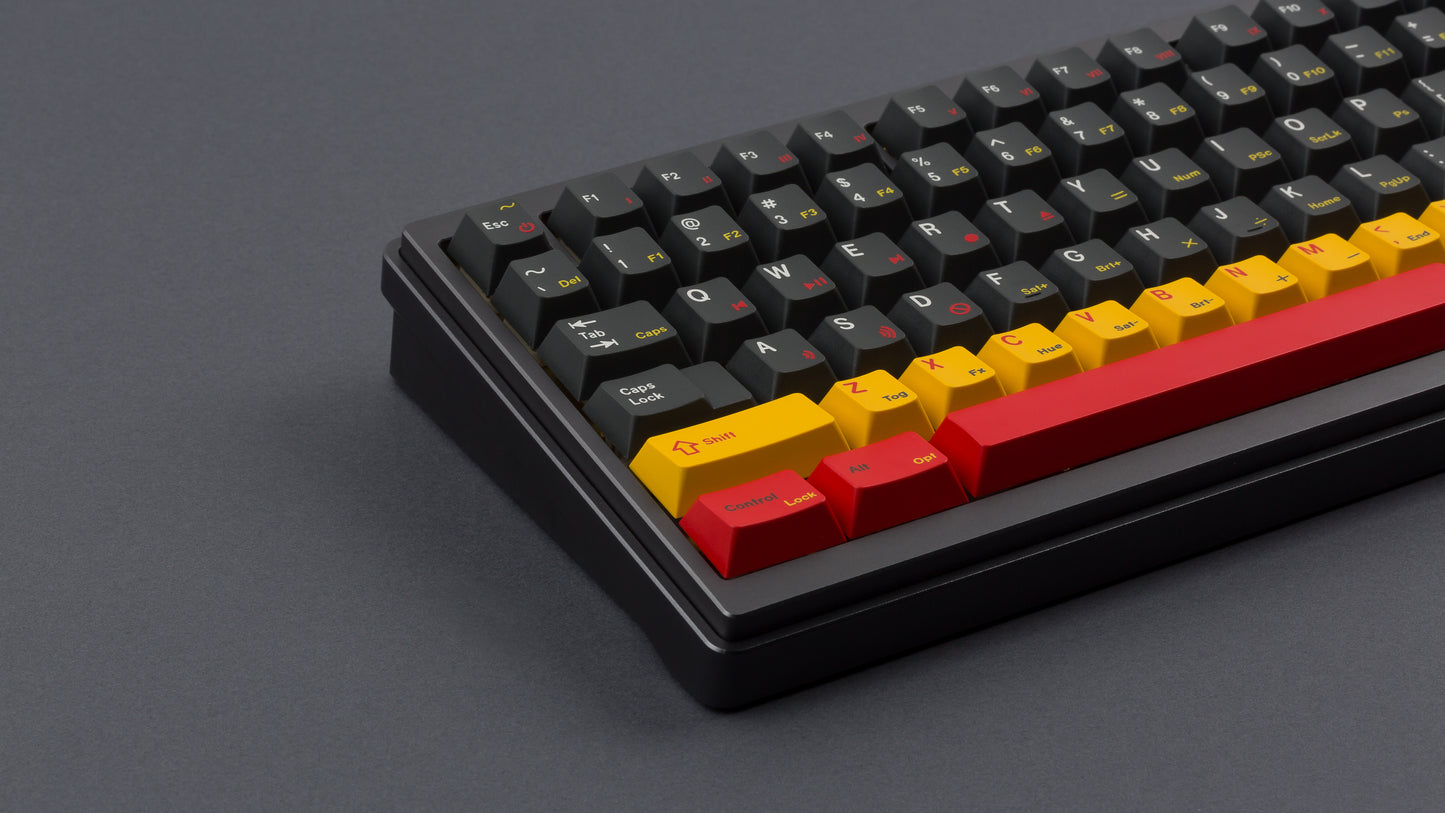 gmk cyl rewind on a full size black keyboard close up on left side angled
