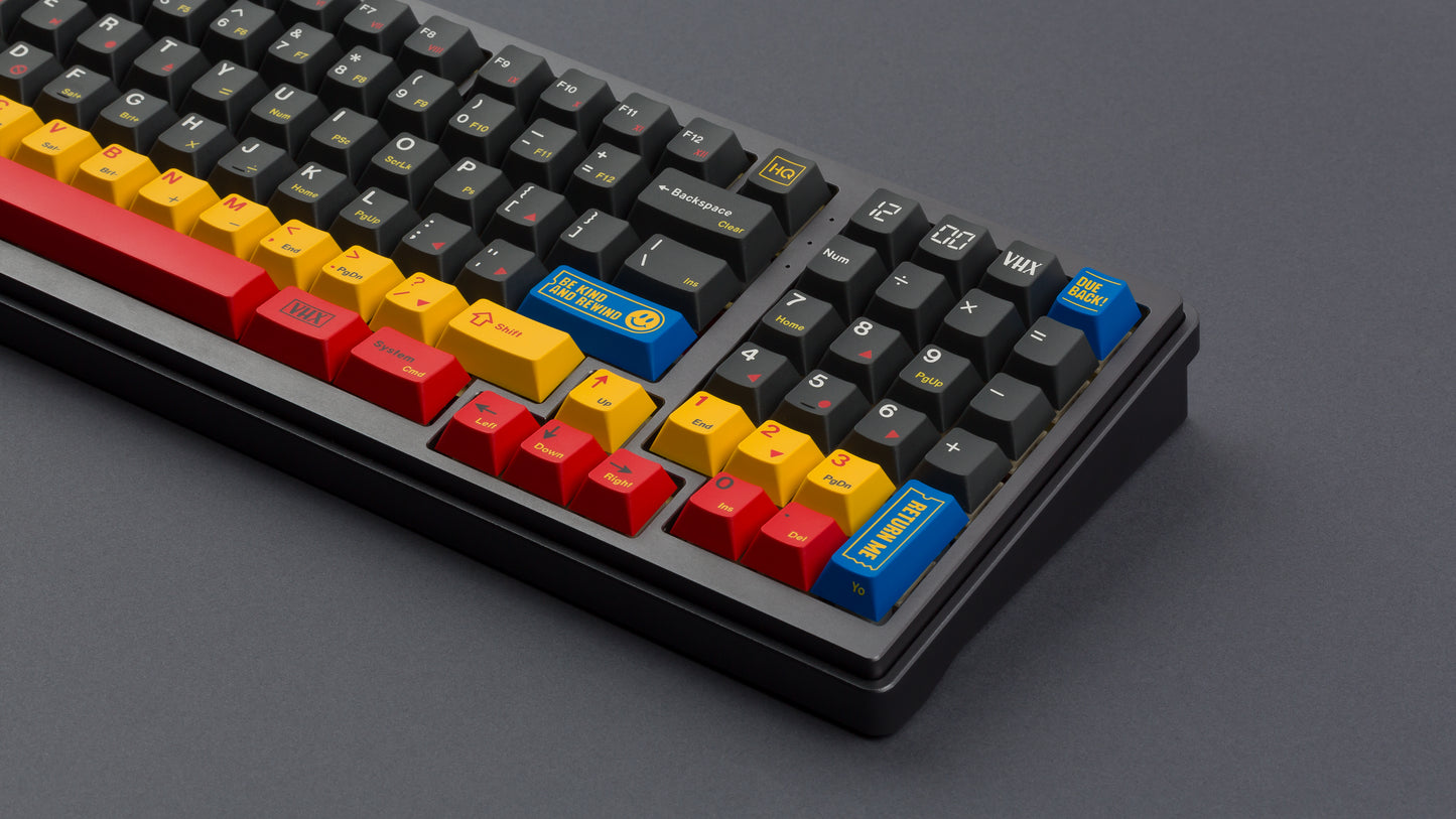 gmk cyl rewind on a full size black keyboard close up on right side angled