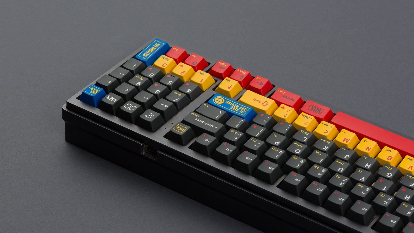 gmk cyl rewind on a full size black keyboard back view angled close up on right side