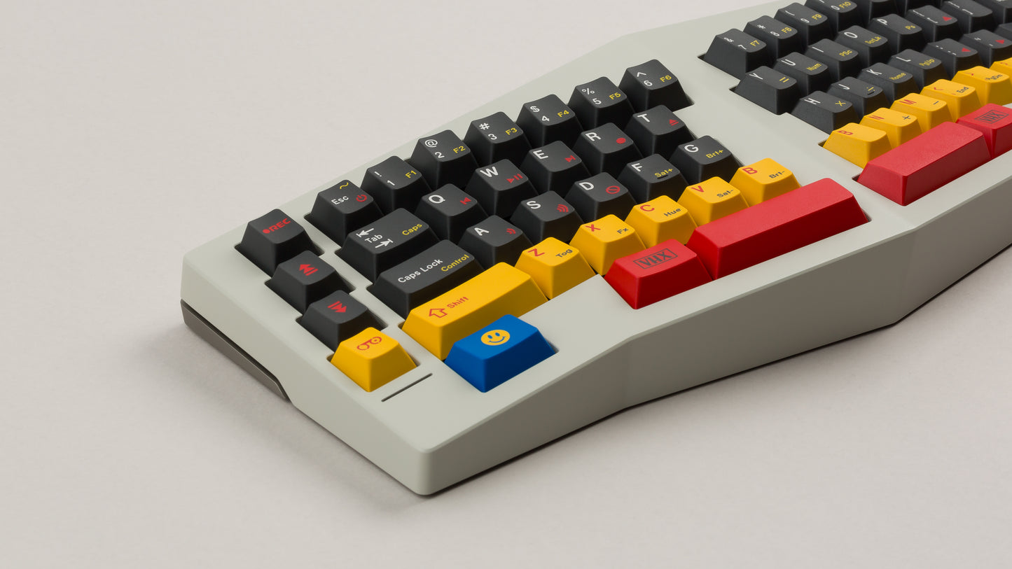 gmk cyl rewind on a beige Type K keyboard close up on left side angled