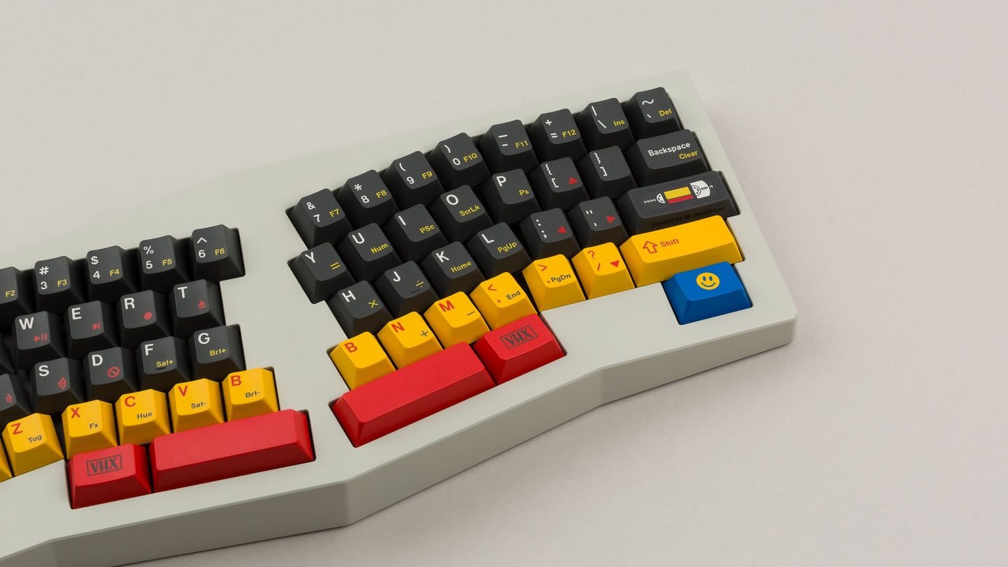 gmk cyl rewind on a beige Type K keyboard close up on right side angled